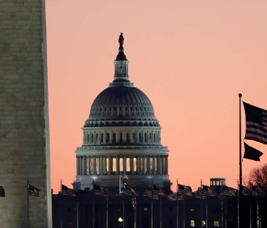 sunset view of the U.S. Capitol dome from a distance