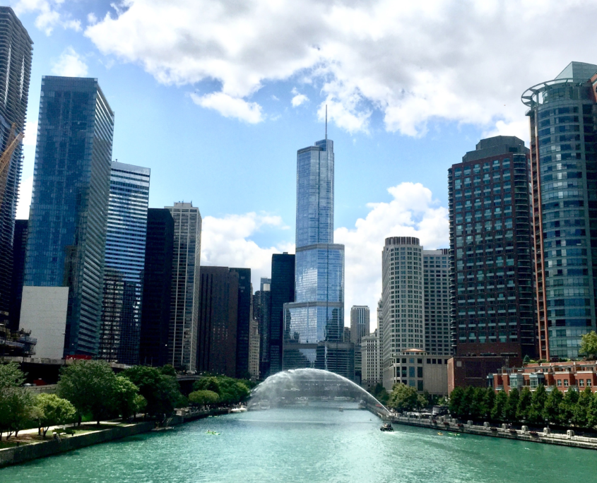 A photo of Chicago, featuring the river running through the city.